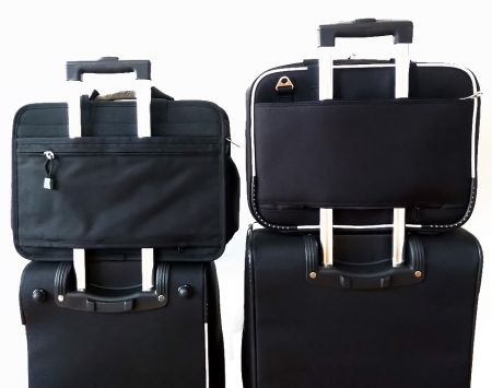 Computer briefcases are designed to rest on top of a suitcase